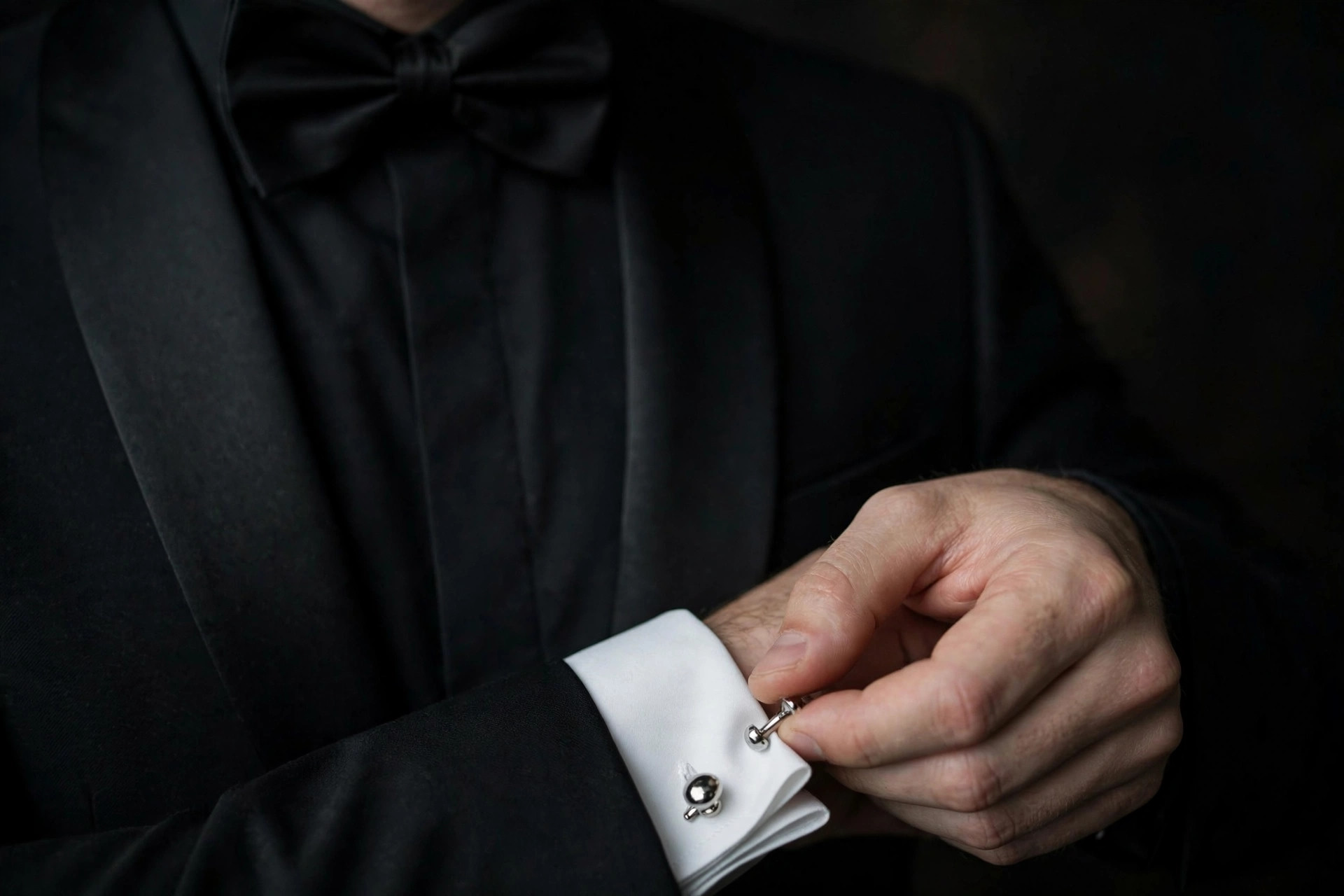 How to deliver James Bond pickup lines with confidence — tuxedo cufflinks close-up